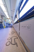 Train interior with bicycle compartment and special floor markings, battery Electric train with