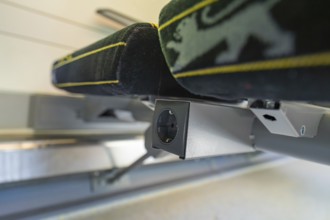 Detail of a modern seat with socket in the interior of a vehicle, battery Electric train with green
