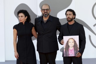 Venice, Italy - 3 September 2025: Clara Khoury, Amer Hlehel, Motaz Malhees with a portrait of