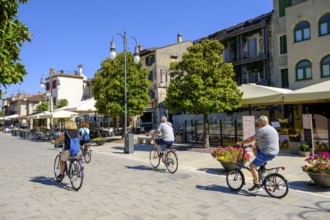 Cyclist, old town centre, Grado, Julian Friuli, Adriatic Sea, Italy