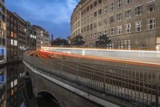 Long exposure at Mönkedamm with underground line U3 and light strip and St Michael's Church in the