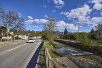 River Bischofswieser Ache, road, trees, hill, crash barrier, shadow, blue sky, cumulus clouds,
