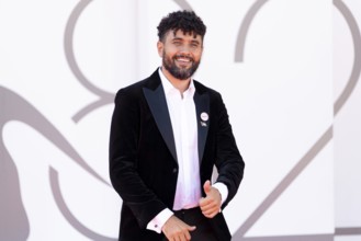 Venice, Italy - 3 September 2025: Amine Bouhafa wears a sticker in the colours of the Palestine