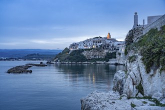 The old town centre of Vieste at dusk, Vieste, Gargano, Apulia, Italy
