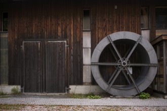 Historic wheel for processing grain, organic farm, Burgrain adventure farm near Willisau,