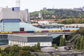 Goods train travelling on the Schusterbahn, Münster viaduct with EnBW Energie Baden-Württemberg