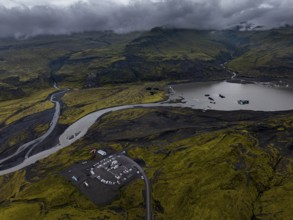 Lake, mountains, car park, car, mass tourism, overtourism, cloudy, rainy, summer, aerial view,
