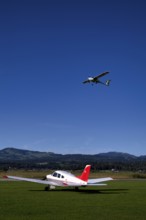 Pipistrel Velis Club with aircraft registration HB-NPP taking off over Piper Archer II HB-PPY on