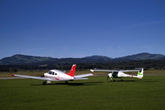 Pipistrel Velis Club on the right with aircraft registration HB-NPP stands next to Piper Archer II
