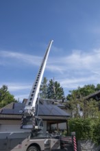 Installation of a large skylight with the help of a mobile crane, Bavaria, Germany