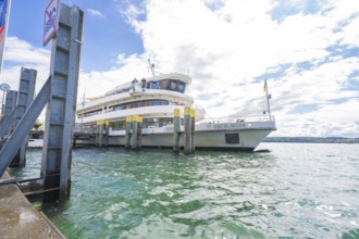 A ship moored at the harbour of Überlingen under a cloudy sky, Lake Constance, Germany