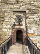 View over fortified bridge to historic small narrow castle gate Access to castle courtyard of 13th
