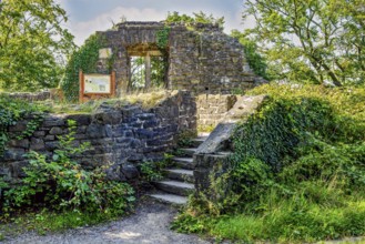 View down old staircase in historic castle courtyard to entrance of former residential building