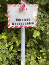 Warning sign indicating road damage, Essen, North Rhine-Westphalia, Germany