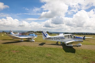 View of two single-engine cantilever low-wing propeller aircraft Light aircraft left type Robin DR