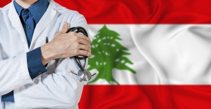 Doctor with stethoscope on Lebanon flag. Doctor holding stethoscope on Lebanon flag