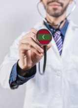 Maldives health and medical insurance concept. Maldives healthcare system, doctor holding