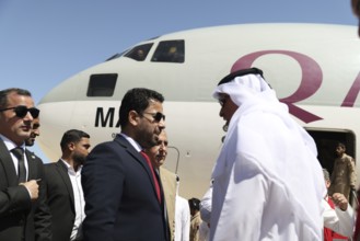 Syrian Health Minister Musab al-Omar welcomes a Qatari aircraft loaded with medical and