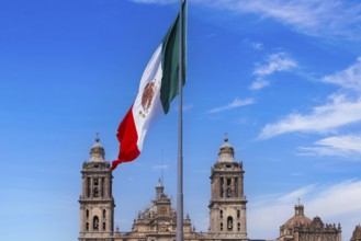 Mexican flag in Zocalo Constitution Square. Mexico city, Metropolitan Cathedral and National Palace