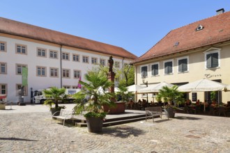 Ettlingen, Germany - August 13th 2025: Fountain at Ettlingen Schlosplatz town square on a sunny day