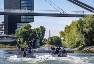 Exercise run of a multi-purpose pontoon on the Rhine, Medienhafen, the skipper gives instructions