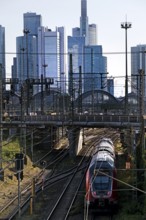 Elevated city view with regional train and skyscrapers, Frankfurt am Main, Hesse, Germany