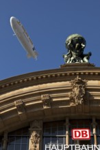 Main front of the main railway station with Atlas carrying the globe on his shoulders and a