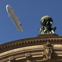 Main front of the main railway station with Atlas carrying the globe on his shoulders and a
