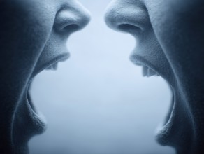 Two open mouths stand close to each other, shouting at each other and creating a tense atmosphere,