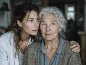 A young carer lovingly looks after a senior citizen in a nursing home, nursing home, symbolic image