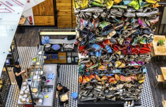 Interior design, artwork made from compressed scrap cars, partially vacant Shopping Quartier 205 in