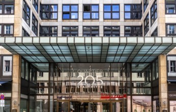 Main entrance to commercial property, partially vacant Shopping Quartier 205 on Friedrichstrasse