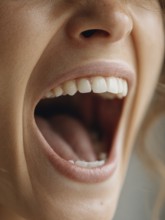 Close-up of a laughing, open mouth with visible teeth, expression of joy, AI generated
