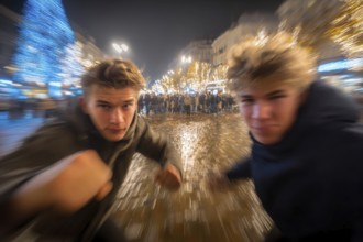 Two men in fighting pose on a rainy street at night, surrounded by lights, symbolic image for