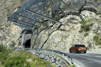 Safety nets on the rock face at the exit of the Petits Pontis tunnel protect road traffic on the