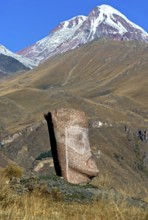 Stone sculpture of a male head, open-air exhibition Stone Heads of Sno by sculptor Merab