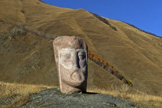 Stone sculpture of a male head, open-air exhibition Stone Heads of Sno by sculptor Merab