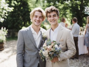A same-sex couple in a suit, one kissing the other on the cheek, surrounded by guests outdoors,
