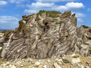 Tourist attraction destination Agios Pavlos Rock with striking folded rock, Agios Pavlos, Crete,