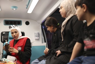 Syrian Arab Red Crescent volunteers conduct first aid training for children during the Damascus