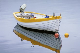 Fishing boat reflected on the lake, England, Great Britain