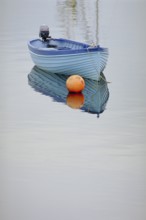 Fishing boat reflected on the lake, England, Great Britain