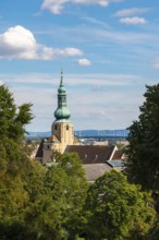 Church tower of St Stephan in Baden in front of a blue sky with clouds, Baden, Lower Austria,