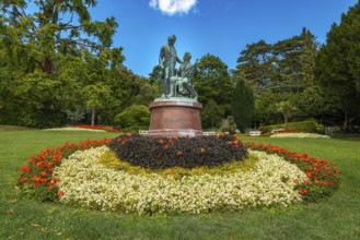 Lanner-Strauss monument surrounded by flowers and trees in the spa garden Baden, Lower Austria,