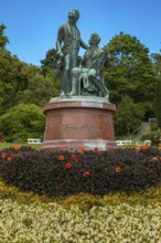 Lanner-Strauss monument surrounded by flowers and trees in the spa garden Baden, Lower Austria,