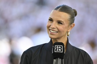 DAZN presenter Laura Wontorra, smiling in interview microphone microphone logo portrait,