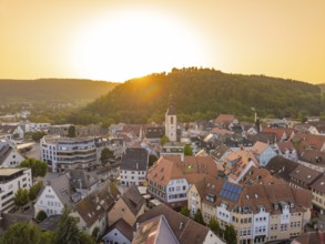 Charming old town at sunset with church tower and surrounding hills, small town pearl Nagold, Black