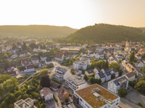 Idyllic town view at sunset with green hills and houses, small town pearl Nagold, Black Forest,