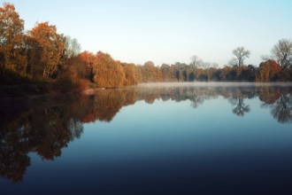 Calm pond with autumn trees and clear reflection, Krefeld