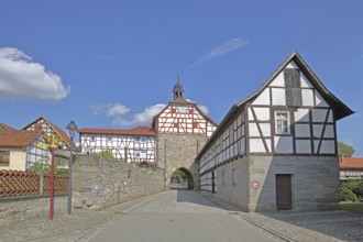 Historic Lower Tor with spire and clock and half-timbered houses, Tor tor, town gate, town wall,
